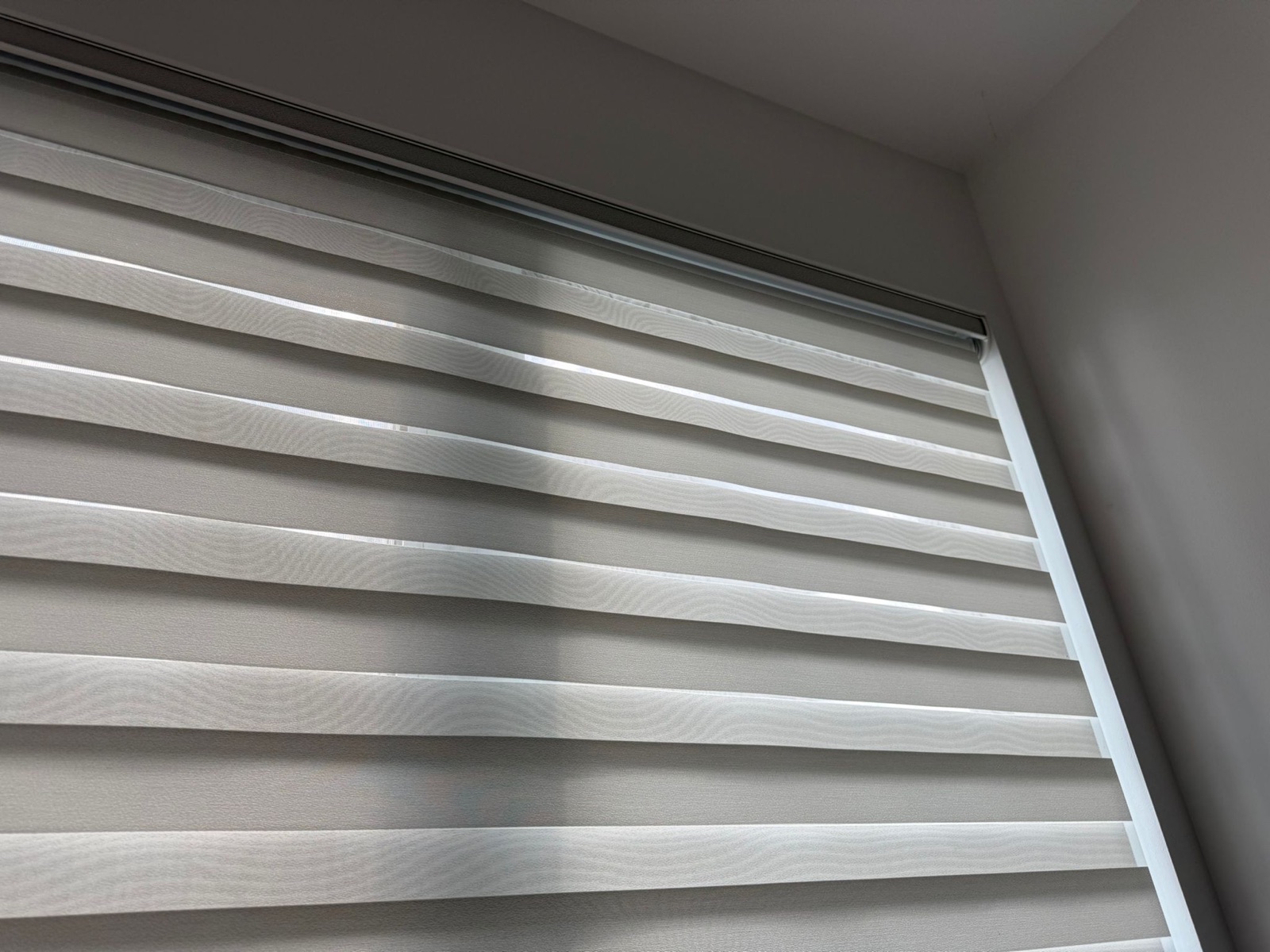 Zebra day and night blind installed on an interior window