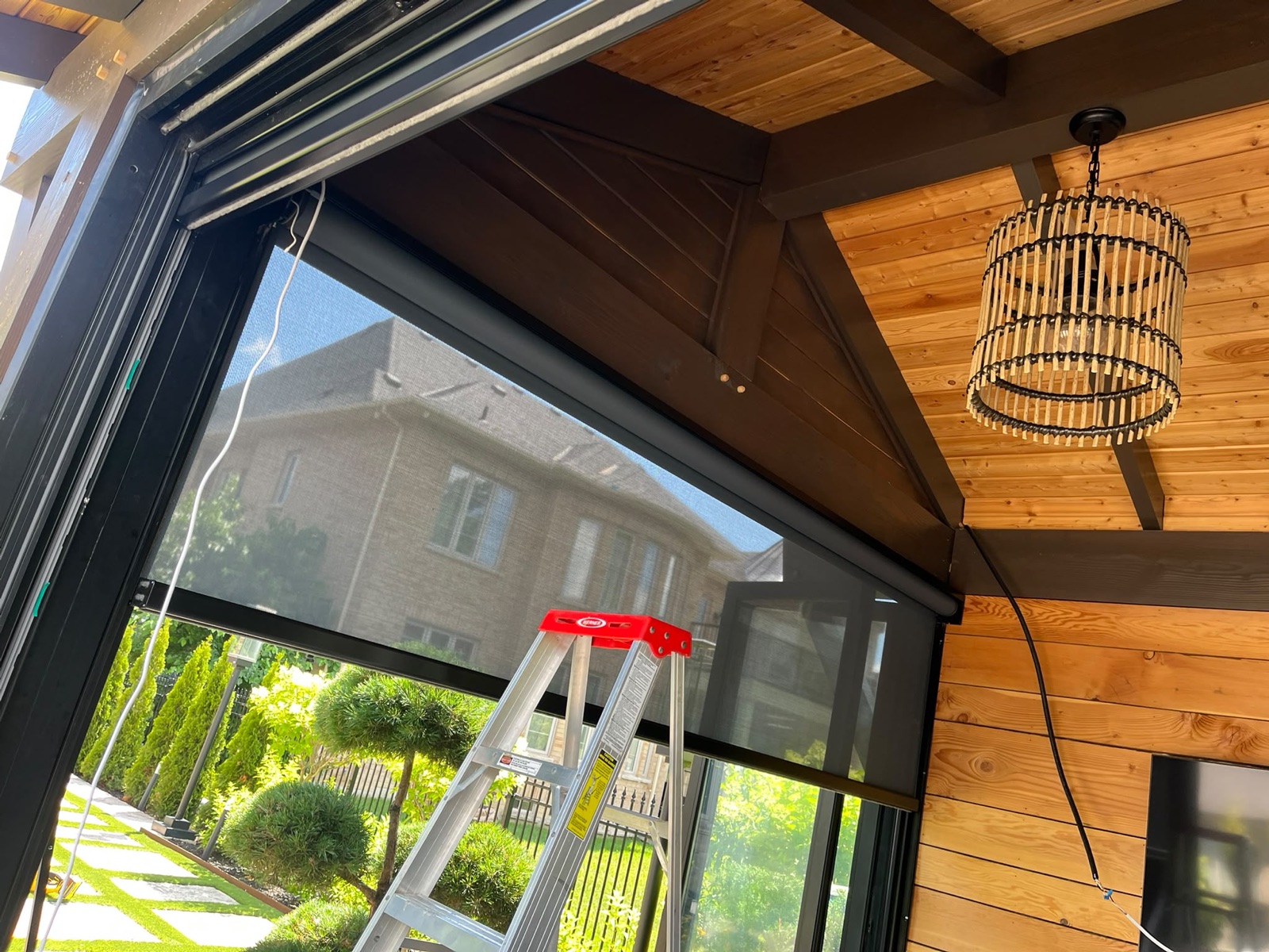 Outdoor screen system installed on a pool cabana, view 009