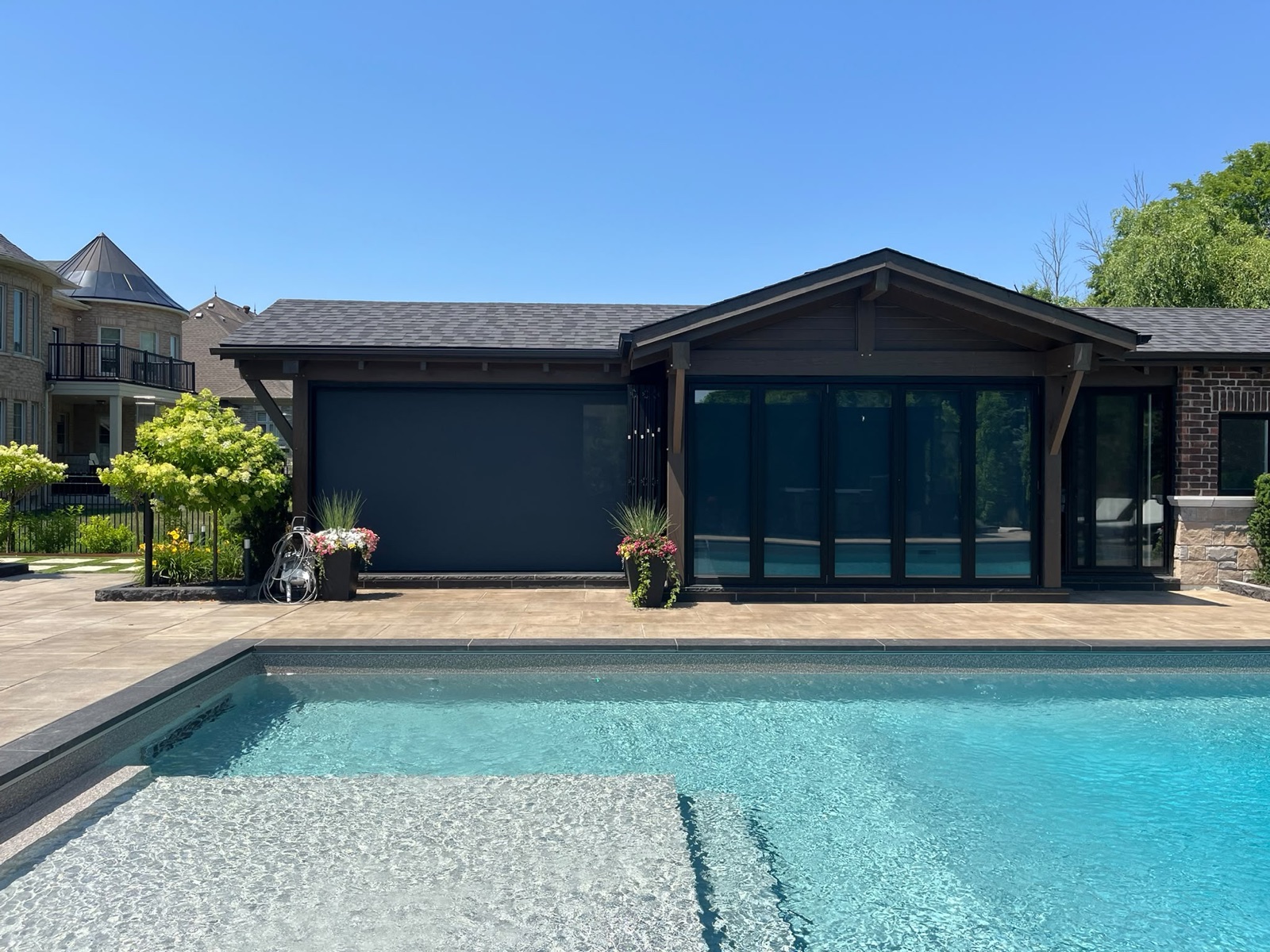 Outdoor screen system installed on a pool cabana, view 012