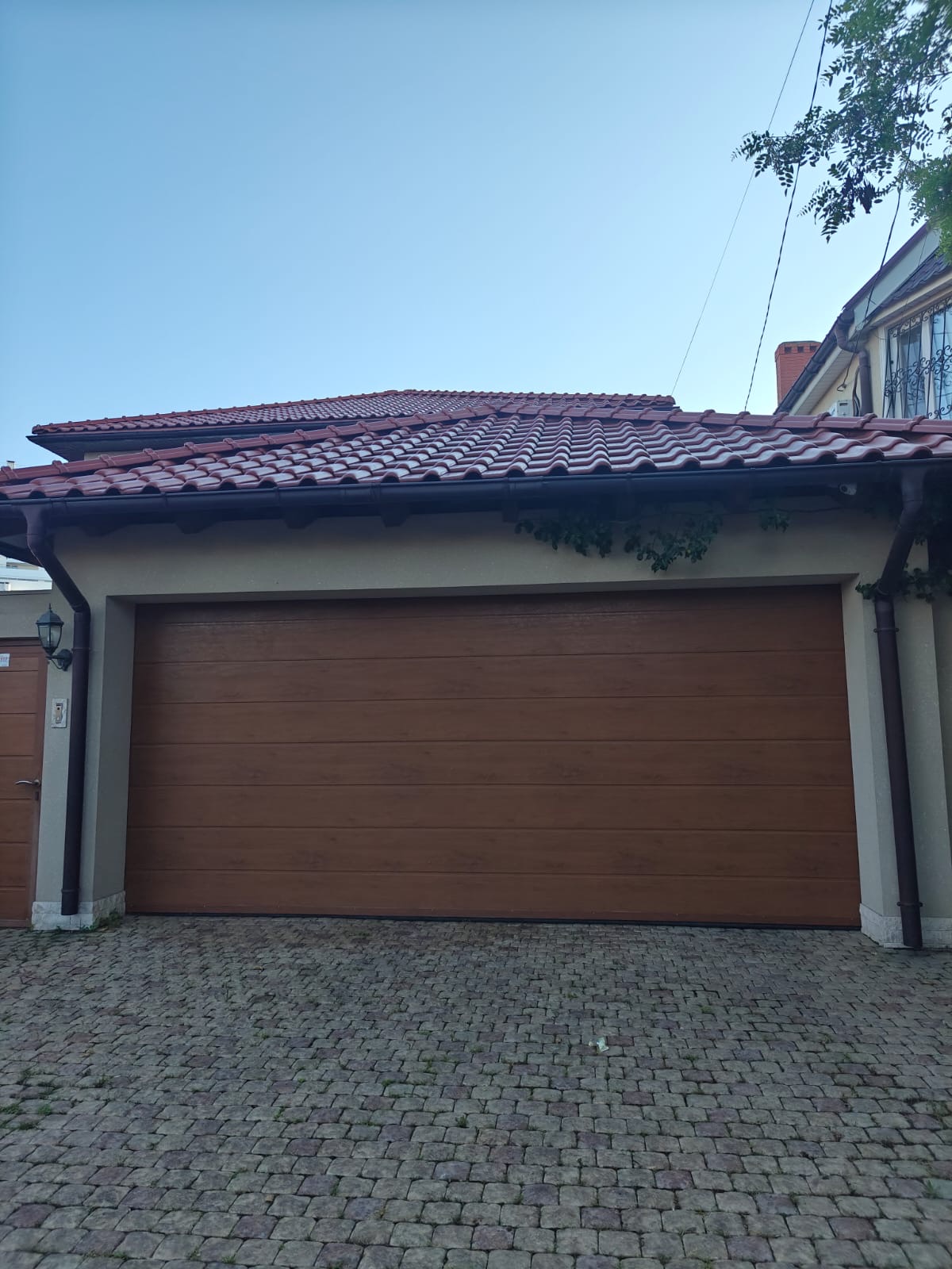 Rolling garage door on a residential property, view 007