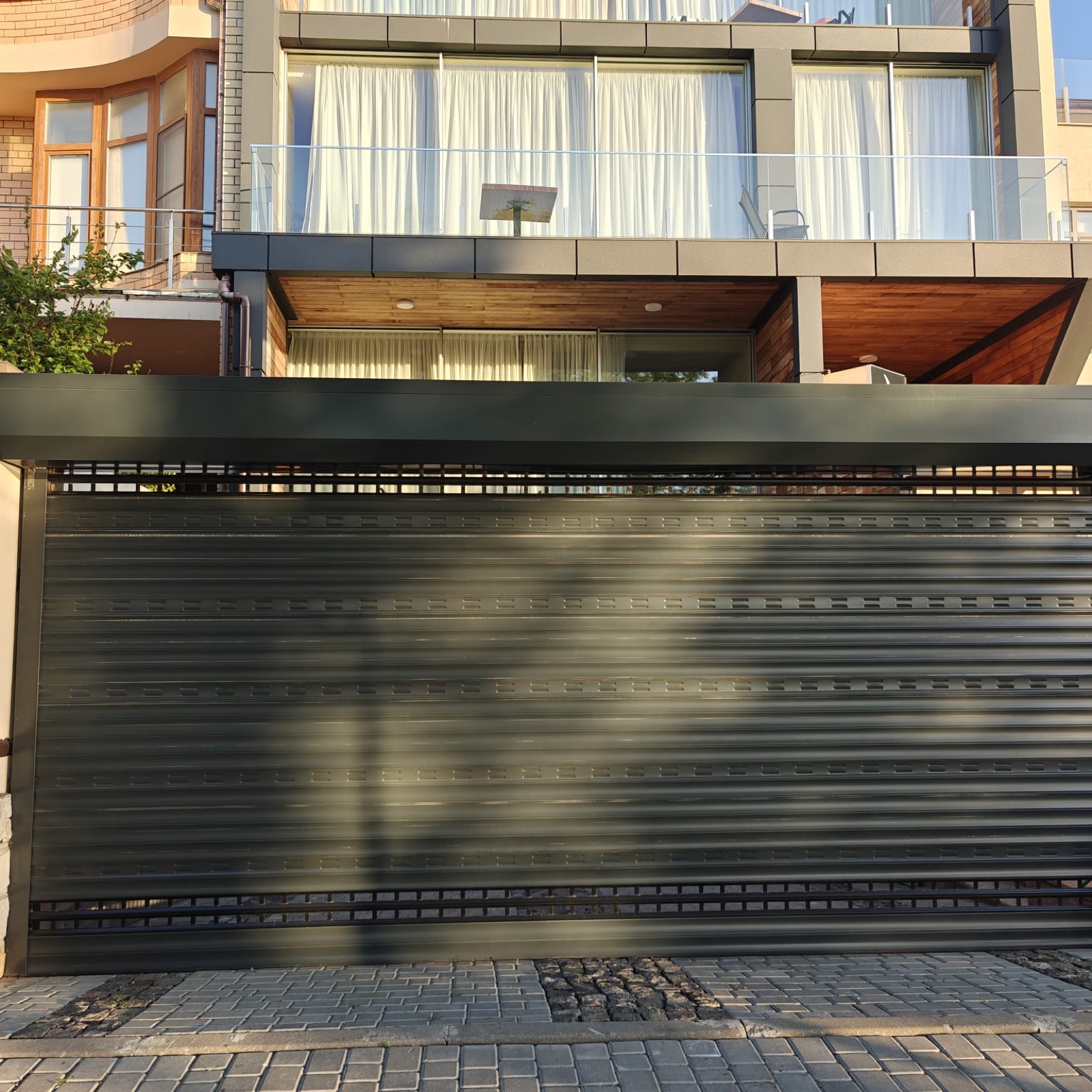 Rolling garage door on a residential property, view 010