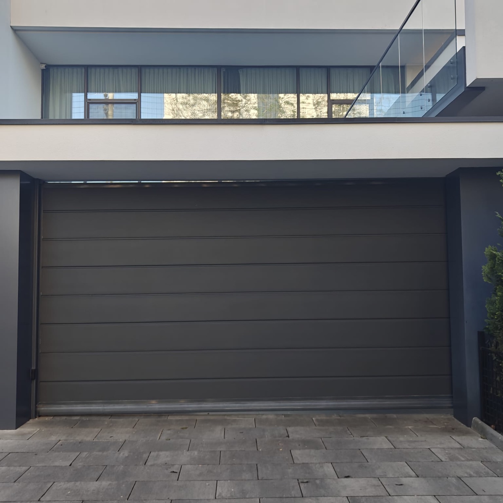 Rolling garage door on a residential property, view 011